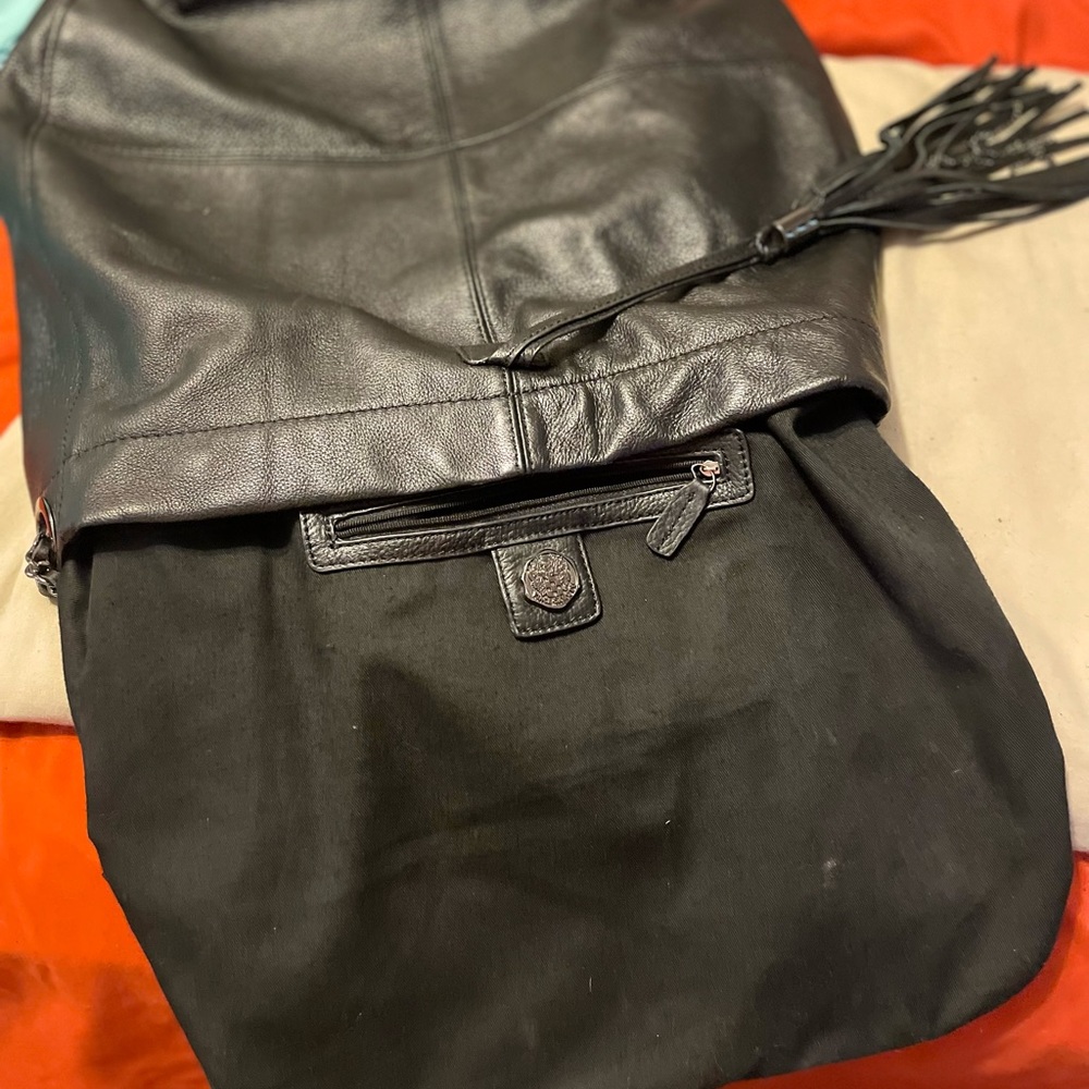 Black Vince Camuto purse with chain tassel